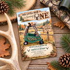A rustic hunting-themed first birthday invitation card styled on a wooden surface with antlers, pine branches, pinecones, and camouflage fabric around it. The card features a green toy wagon, fall landscape illustration, and hunting text.