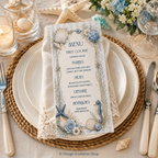 Nautical-themed menu on a table setting with plates, cutlery, and flowers.